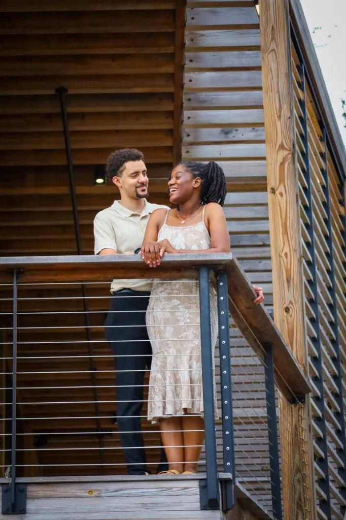 Engaged couple on a boardwalk at Bonnet Springs Park, Lakeland — fine art photography by Cute Company Photography in Plant City & Tampa, FL