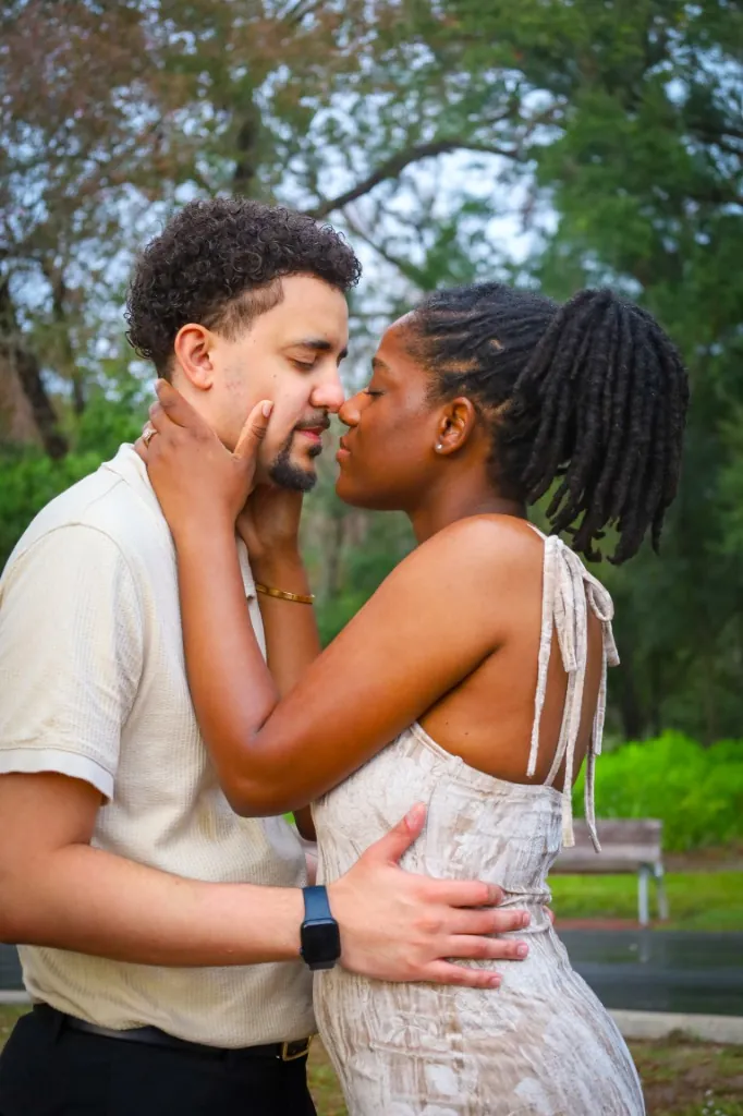 Candid engagement embrace at Bonnet Springs Park, Lakeland — fine art photography by Cute Company Photography in Plant City & Tampa, FL